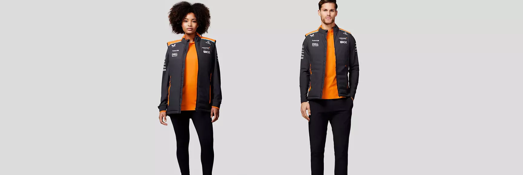 Two models wearing F1 teamwear jackets